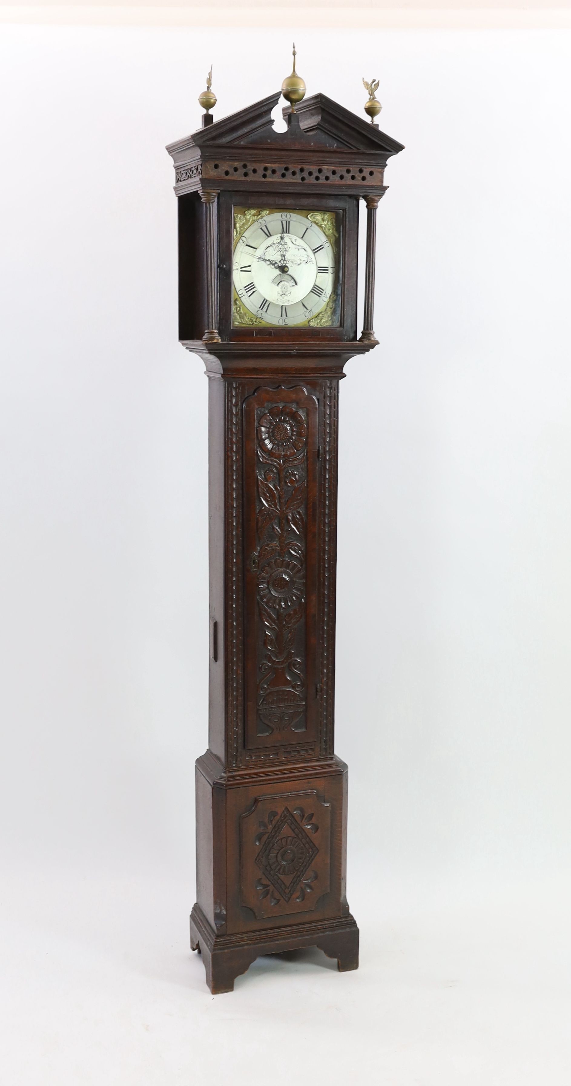 A George III oak cased thirty hour longcase clock, by Price Evans, Salop, the 28cm dial with calendar aperture, case later carved, height 230cm